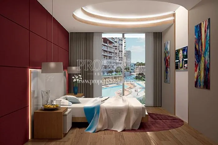 The bedrooom with the compound landscape view in one of Nidapark Yenisahra apartments