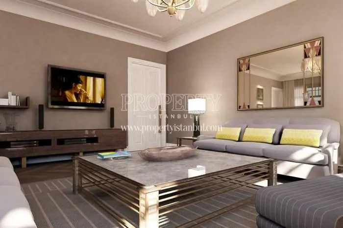 The living room with a lilac lounge suite in Nisbetiye On