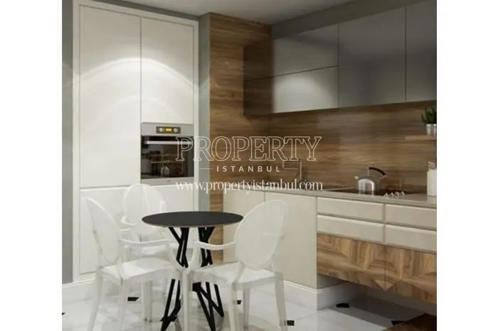 Small black round dining table in the small kitchen in Ofton Beyoglu