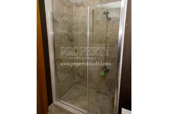 Small shower cabin in one of the apartments in Olimpa Park Plus
