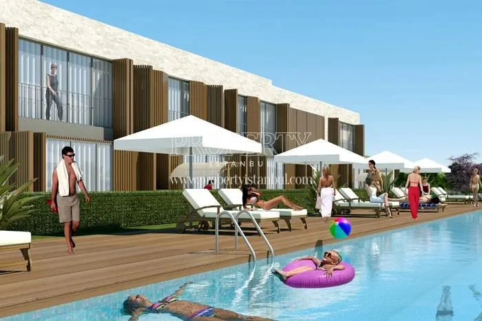 The residents swimming in the compound pool in Olivo Atakent