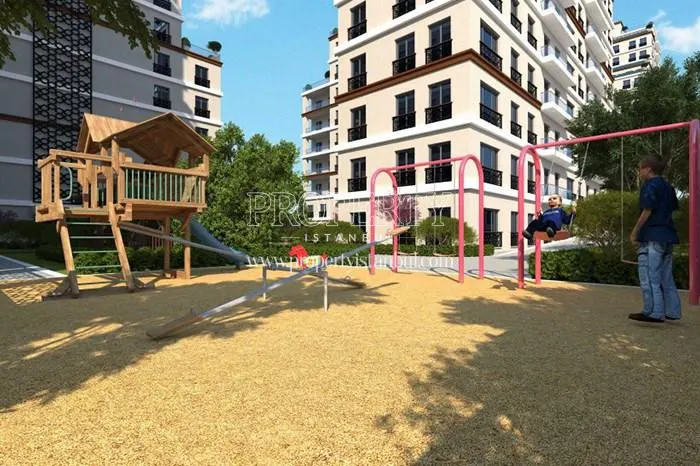 The man playing with his daughter in the playground for children in Omur Istanbul