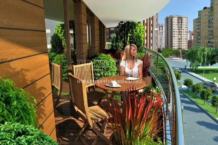 The woman viewing the Onay Garden Residence compound from the balcony