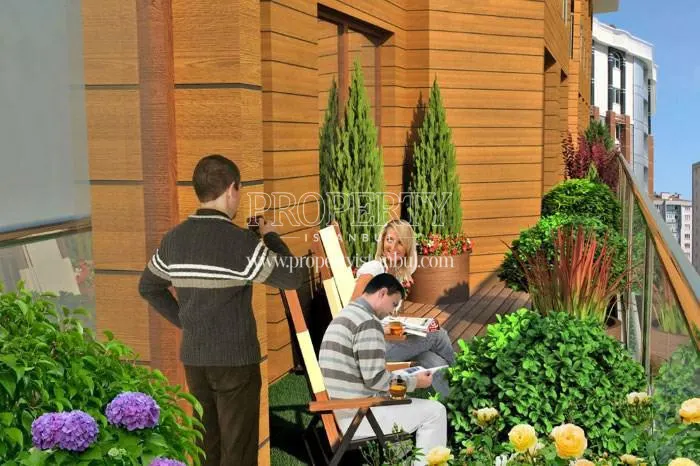 The happy family on their verdant balcony in Onay Garden Residence