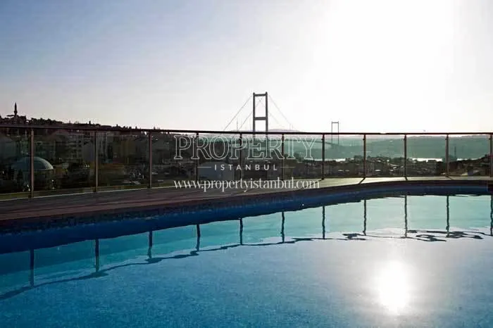 The outdoor swimming pool on the One Ortakoy roof, which faces the bridge