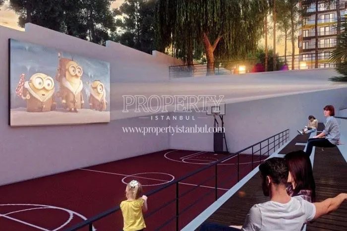Open-air cinema next to the basketball court in the Optimum Gardens compound