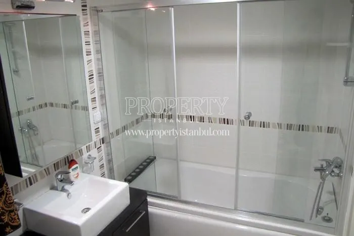The bathroom with a small sink and a big bathtub in Orion Park