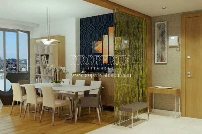 Light brown dining table in one of the living rooms in Ozak Hayattepe homes