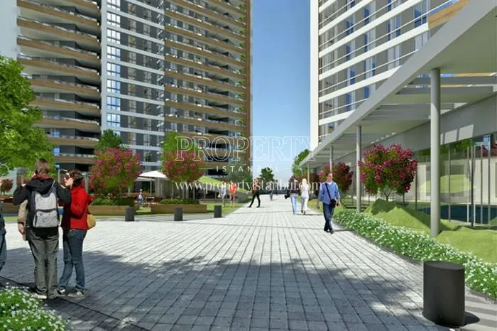 Ozak Hayattepe residents walking in the compound garden