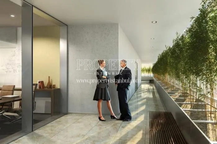 People talking in the lobby of Palladium Tower