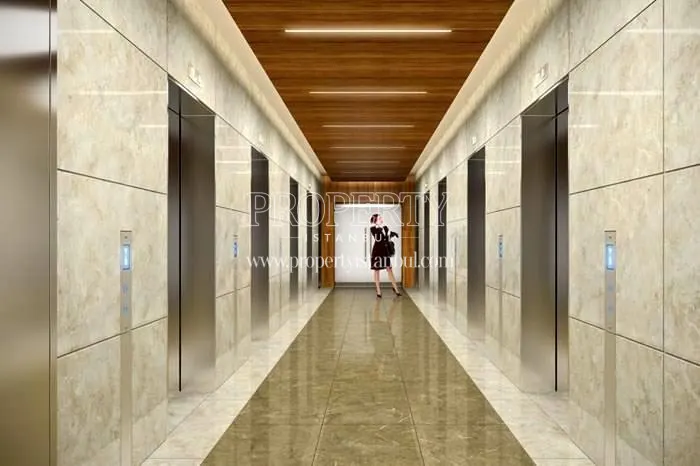 The woman taking the elevator in Palladium Tower