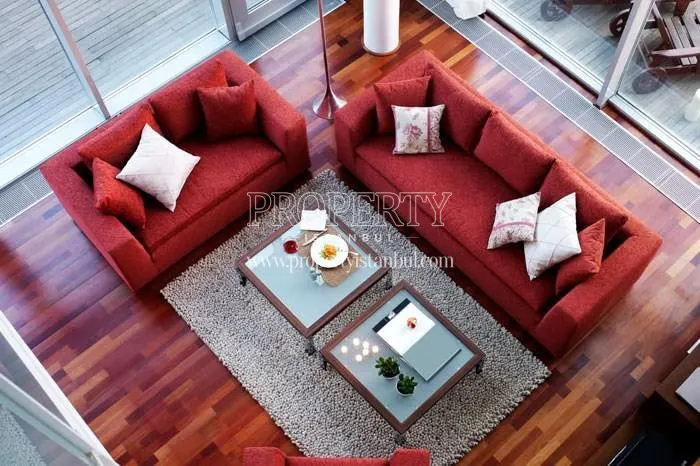 The living room with the red sofa in Panaroma Home