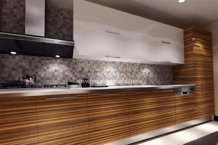 Striped brown kitchen cabinets in one of the Paradise Gunesli apartments