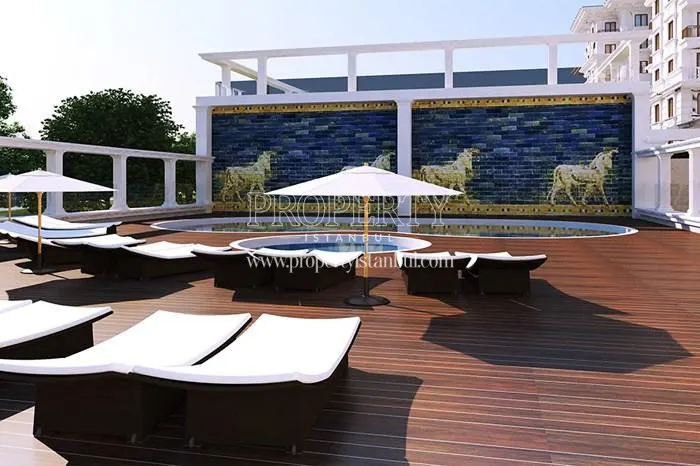 Sunbeds near the outdoor swimming pool in the Pergamon Koskleri compound