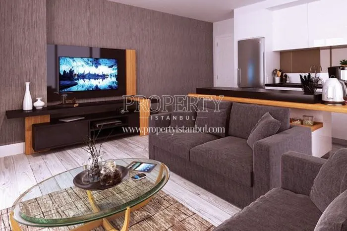 Small living room with a grey lounge suite in Perola Residence
