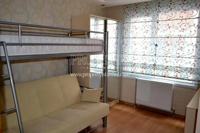 Bunk bed whose lower level is a couch in the small living room in Propa Plus Residence