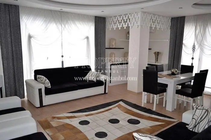 Black and white furnished living room in Propa Plus Residence