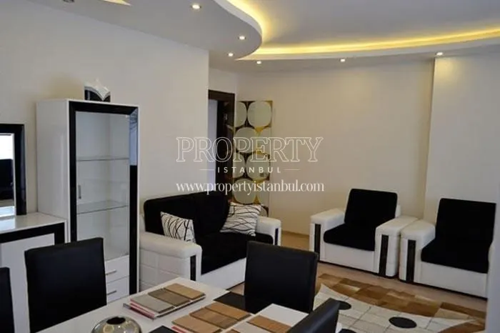 Black and white lounge suite in one of the living rooms in Propa Plus Residence