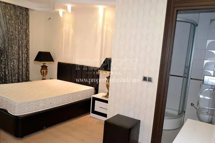 The master bedroom with a bathroom in Propa Plus Residence