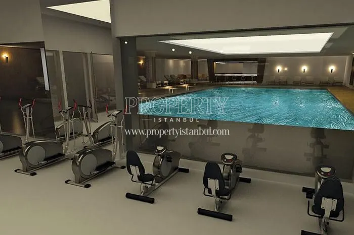 The gym with the indoor swimming pool in Real Istanbul Residence
