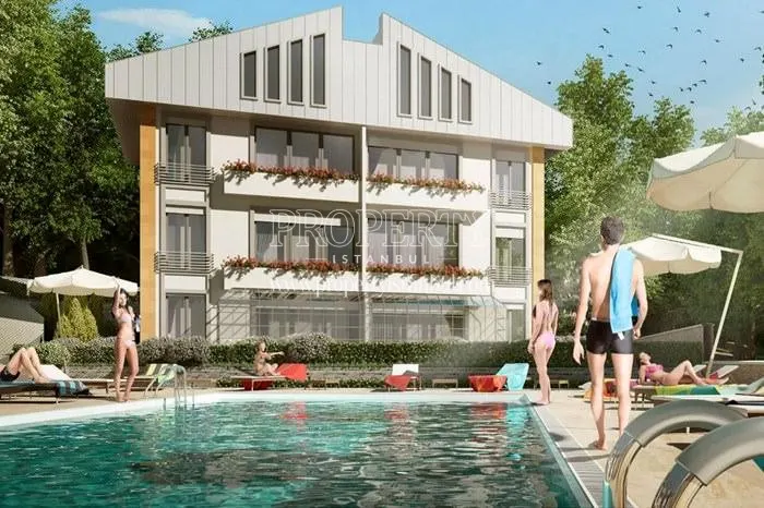 Outdoor swimming pool in front of one of the Real Life Konaklari blocks