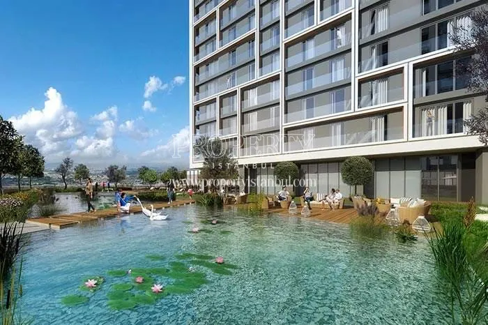 Referans Gunesli residents enjoying themselves near the artificial lake