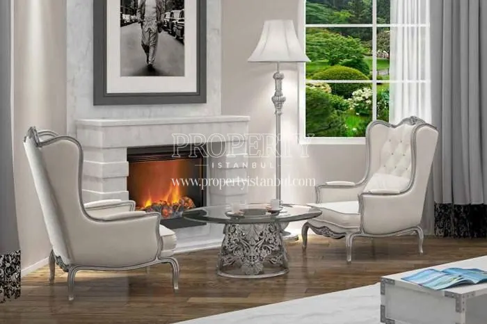 The fireplace with the white furniture in one of the living rooms in the Riva Hills compound