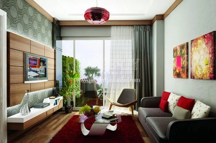 The living room with a balcony in Saloon Residence