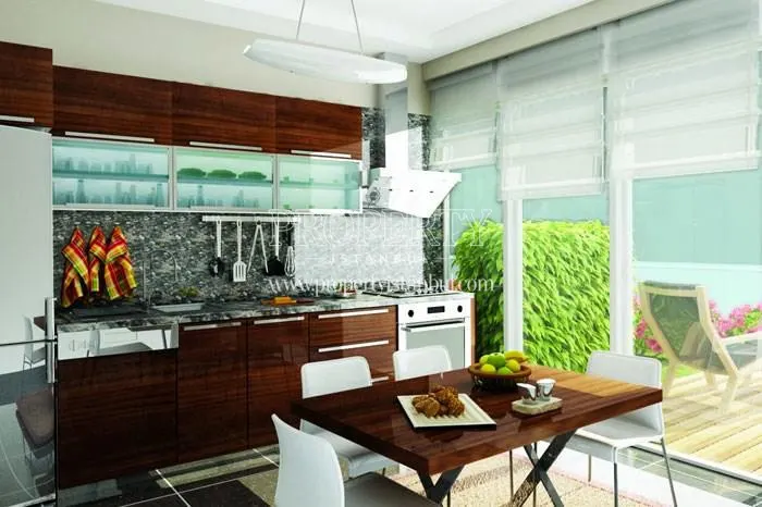 The kitchen with a balcony in Saloon Residence