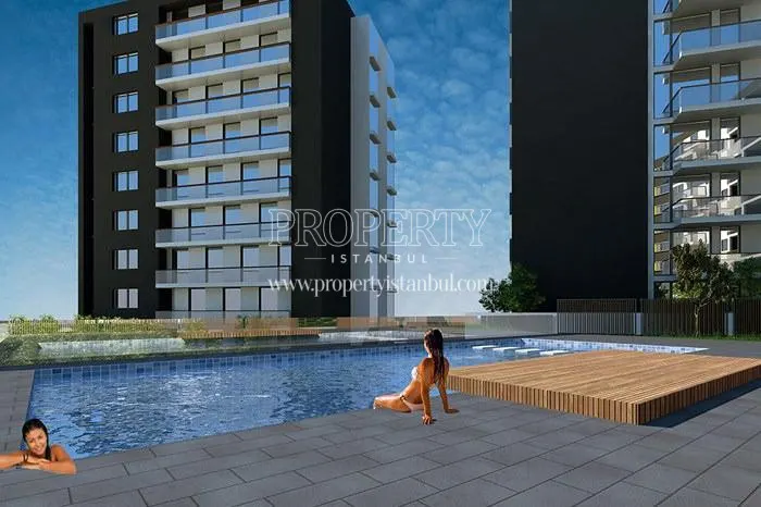 Two women swimming in the Saral 107 compound pool