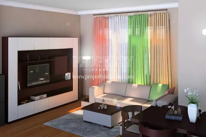 Small white corner sofa with colorful curtain in one of the Sebboy Konutlari apartments