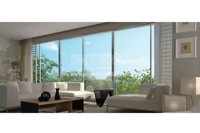 The living room with a white lounge suite in Seckinler Safir Evleri