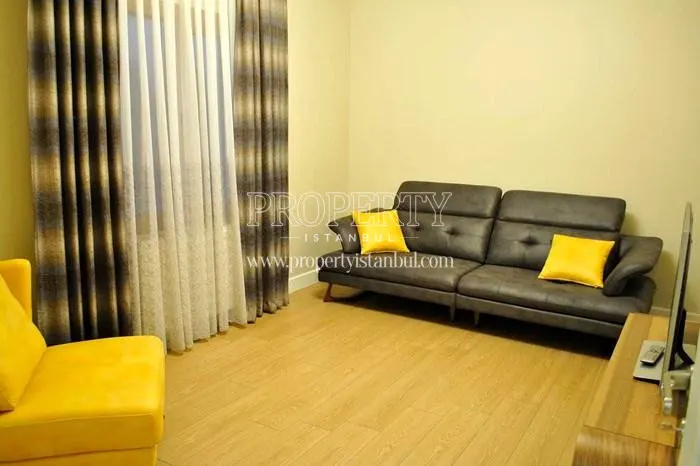 Black and yellow furnished small living room in Sehrigul Konaklari