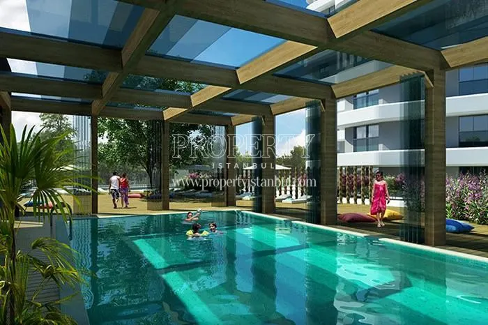 Collapsible glass roof and walls for the indoor swimming pool in the Selective Blue compound