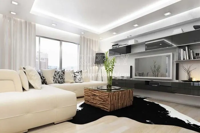 White corner sofa in one of the Seven Four Life Acibadem apartments