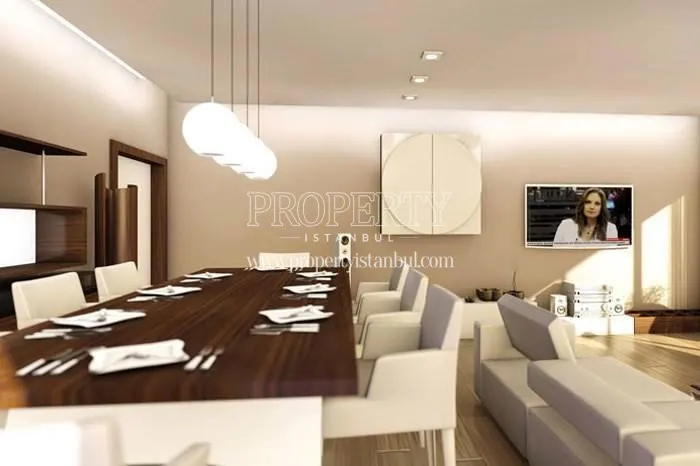 Spacious living room with a long wooden dining table in Silviya Konaklari
