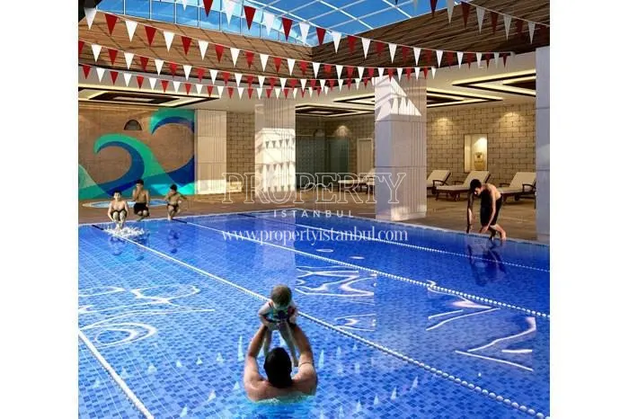The people swimming in the indoor swimming pool of the Sky Blue Istanbul compound