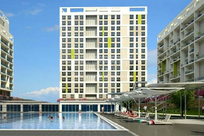 Soyak Evostar residents swimming in the compound pool