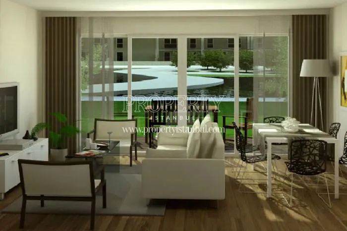White sofa and dining table in one of the apartments in Soyak Park Aparts