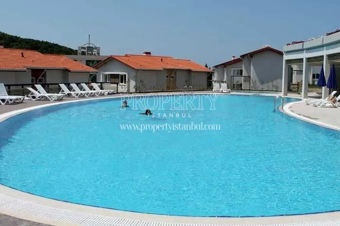 The couple swimming in the Soytez Vadi Evleri compound pool
