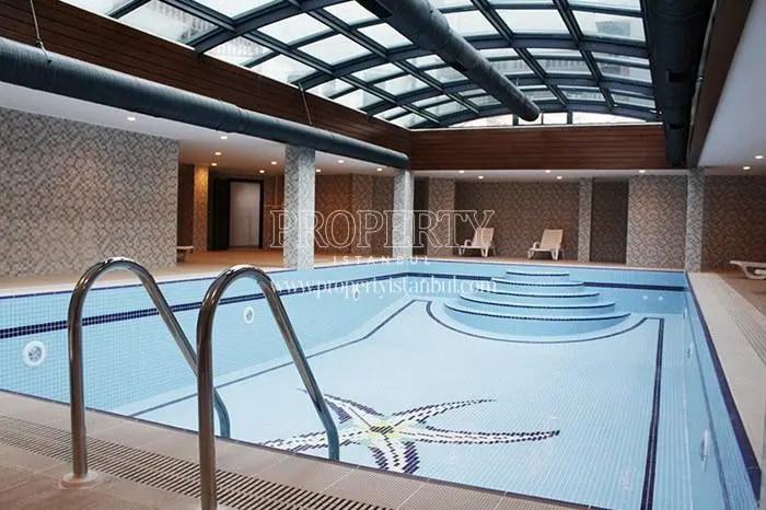 The indoor swimming pool with a glass ceiling in Star Park Evleri