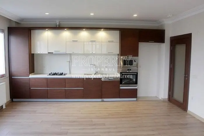 Spacious kitchen with wooden kitchen cabinets in Star Park Evleri