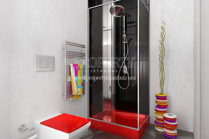 The bathroom with a black and red bathtub in Studyo 24
