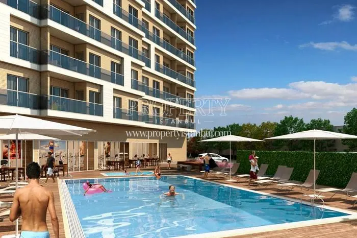 Sur Yapi Tilia residents swimming in the Sur Yapi Tilia compound
