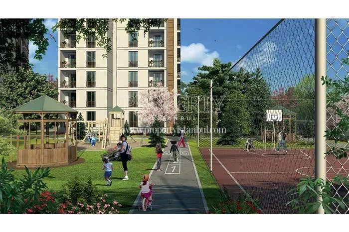 The children playing in the playground for children and sports fields in TEM Expres Residence 116