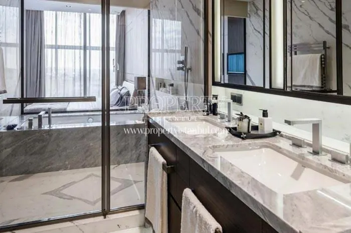 The master bedroom with a bathroom in The Address Residence Istanbul