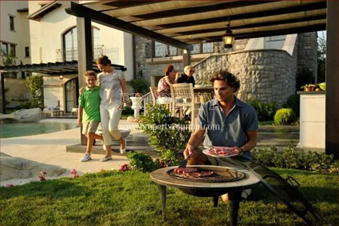 A family having a barbeque in the Toskana Vadisi compound