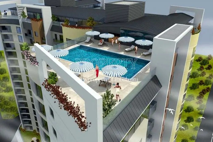 The outdoor swimming pool on the Turkbuku Residence building