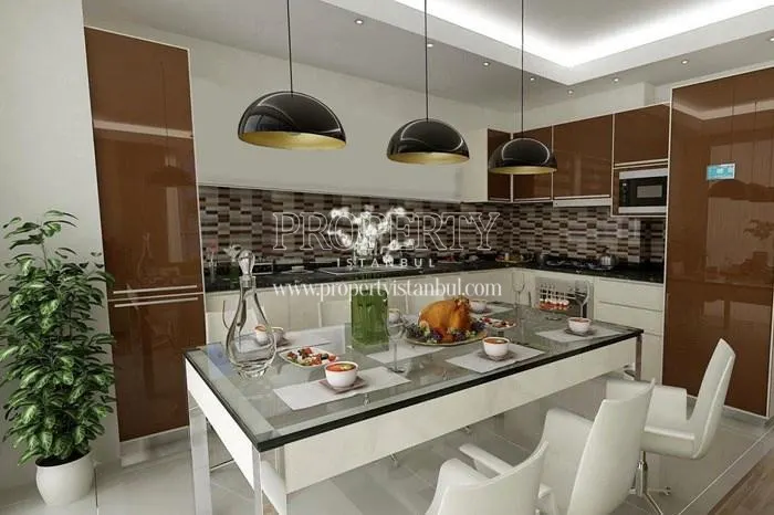 The kitchen with brown and white kitchen cabinets in Tutku Life Residence