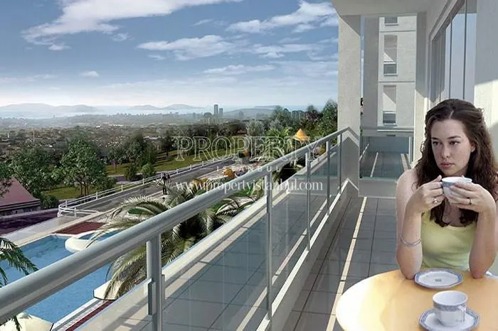 A woman drinking coffee on the balcony in Twinstar Yakacik